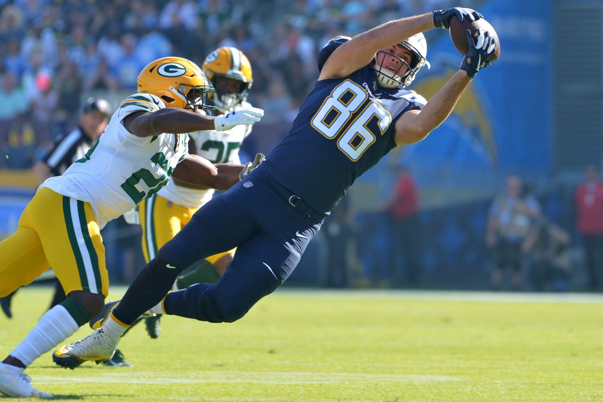 Los Angeles Chargers tight end Hunter Henry makes a first quarter catch as Green Bay Packers cornerback Kevin King defends at Dignity Health Sports Park.