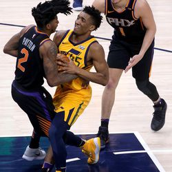 Phoenix Suns guard Elfrid Payton (2) and Utah Jazz guard Donovan Mitchell (45) fight for the ball during a basketball game at the Vivint Smart Home Arena in Salt Lake City on Wednesday, Feb. 14, 2018.