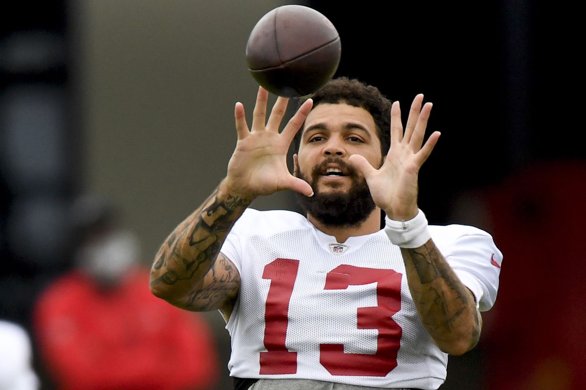 Mike Evans #13 of the Tampa Bay Buccaneers makes a reception during training camp at AdventHealth Training Center on August 30, 2020 in Tampa, Florida.