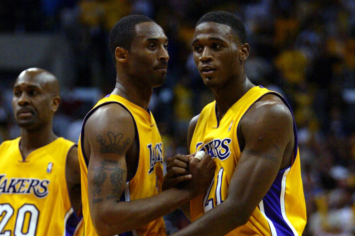 Laker Kobe Bryant congratualtes teammate Kareem Rush after Rush scored 18 points in the Lakers Weste