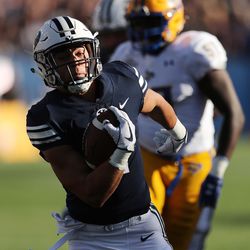 Brigham Young Cougars running back Lopini Katoa (4) runs for a touchdown in Provo on Saturday, Sept. 22, 2018.