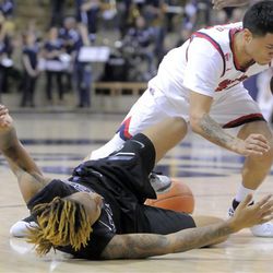 Fresno State guard Cezar Guerrero (12) forces Utah State guard Shane Rector (4) to turn the ball over, Saturday, March 5, 2016, in Logan, Utah. 