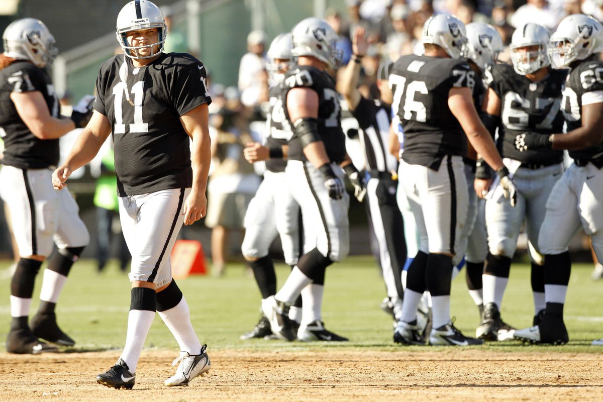 Oakland Raiders kicker Sebastian Janikowski (11) walks off the field after the Raiders attempted a fake field goal attempt against the Dallas Cowboys