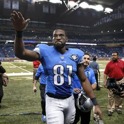 FILE - In this Nov. 9, 2014, file photo, Detroit Lions wide receiver Calvin Johnson waves to fans after defeating the Miami Dolphins 20-16 in a NFL football game in Detroit. Calvin Johnson has retired. The 30-year-old receiver, known as Megatron, announced his decision Tuesday, March 8, 2016, to walk away from the NFL after nine mostly spectacular seasons with the Detroit Lions. 
