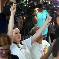 Jolene Mewing cheers during a press conference at the Utah Pride Center in Salt Lake City on Friday, June 26, 2015. In a landmark opinion, the Supreme Court ruled Friday that states cannot ban same-sex marriage, handing gay rights advocates their biggest victory yet. Mewing and her spouse, Colleen, got married in Utah on December 23, 2013.