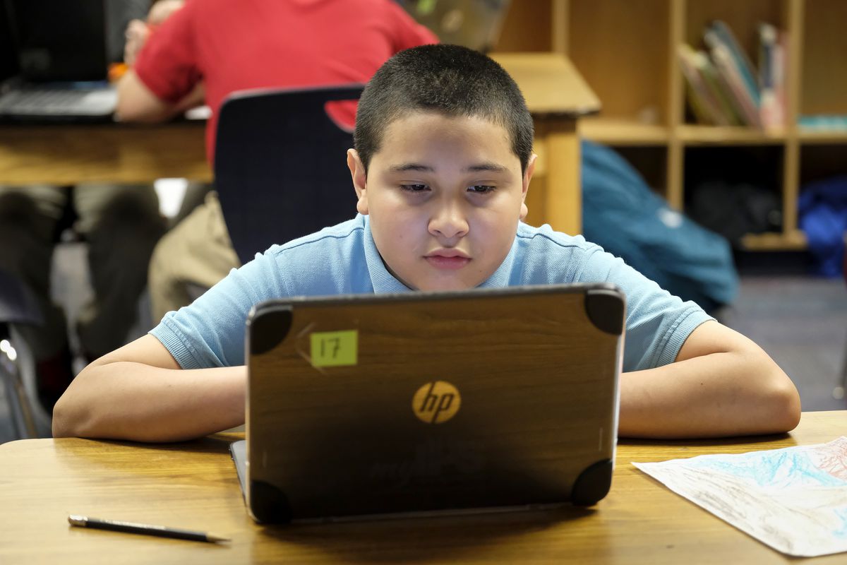 A student works on a laptop computer in class at Thomas Gregg Neighborhood School, an elementary school in Indianapolis, Indiana. —April, 2019— Photo by Alan Petersime/Chalkbeat
