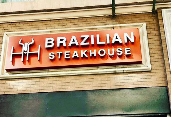 A storefront for H&amp;H Brazilian Steakhouse in Los Angeles, California.