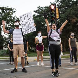 Protesters block traffic as they peacefully march around Kenosha on the fourth day of civil unrest after police shot Jacob Blake, Wednesday night, Aug. 26, 2020.