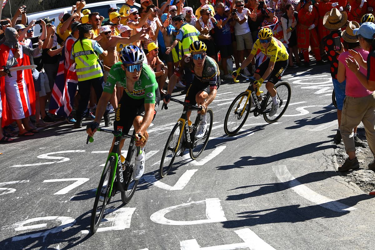 Wout Van Aert of Belgium - Green Points Jersey, Steven Kruijswijk of Netherlands and Jonas Vingegaard Rasmussen of Denmark and Team Jumbo - Visma - Yellow Leader Jersey compete while fans cheer during the 109th Tour de France 2022, Stage 12 a 165,1km stage from Briançon to L’Alpe d’Huez 1471m / #TDF2022 / #WorldTour / on July 14, 2022 in Alpe d’Huez, France.