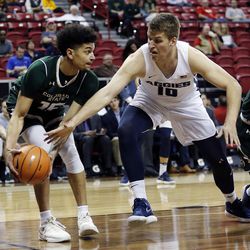 Utah State Aggies forward Quinn Taylor reaches for the ball with Colorado State Rams guard Anthony Bonner at left during the Mountain West Conference basketball tournament in Las Vegas on Wednesday, March 7, 2018.