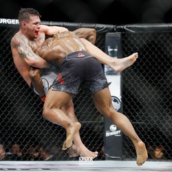 Karl Roberson goes for the takedown at UFC 230.