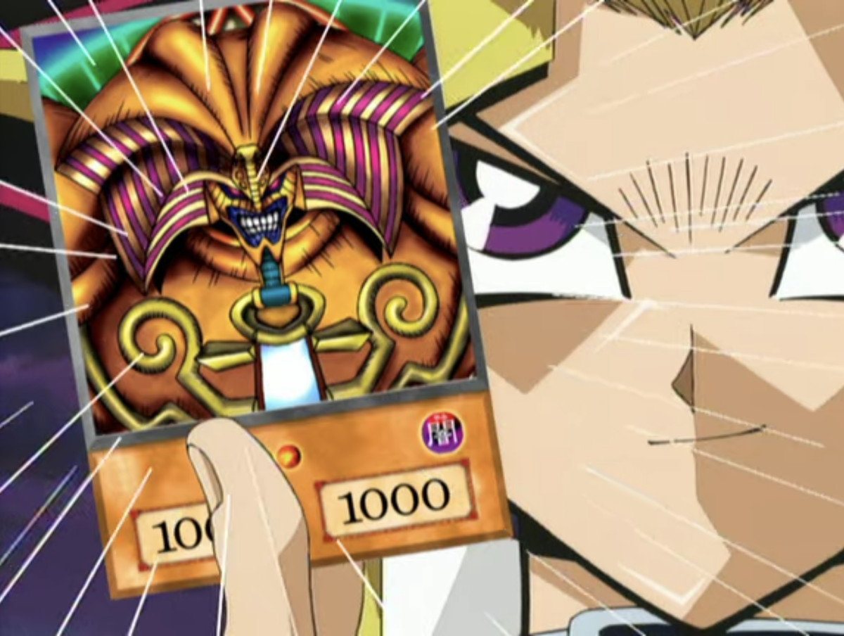 An extreme close-up of Yugi holding up his Exodia card