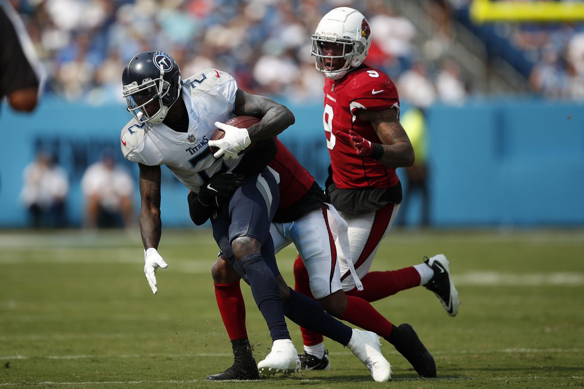 Julio Jones #2 of the Tennessee Titans carries the ball against the Arizona Cardinals at Nissan Stadium on September 12, 2021 in Nashville, Tennessee.