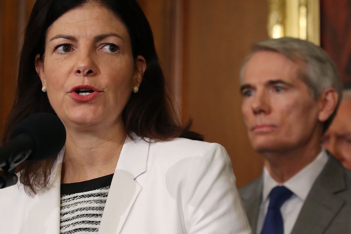 Sen. Kelly Ayotte (R-NH) speaks while flanked by Sen. Rob Portman (R-OH).