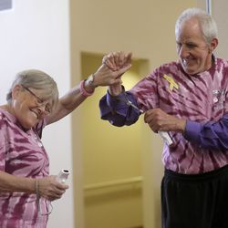 Janet Fitzgerald gets as high-five from Clyde Caldwell while competing in the ninth annual Salt Lake County Senior Wellness Decathlon at the Magna Kennecott Senior Center in Magna on Tuesday, Sept. 17, 2019.