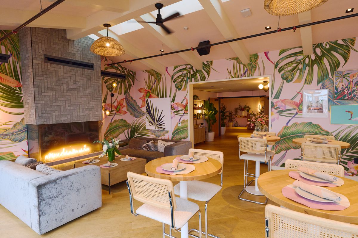 Tropical wallpaper and midcentury inspired furniture at Canopy Club.