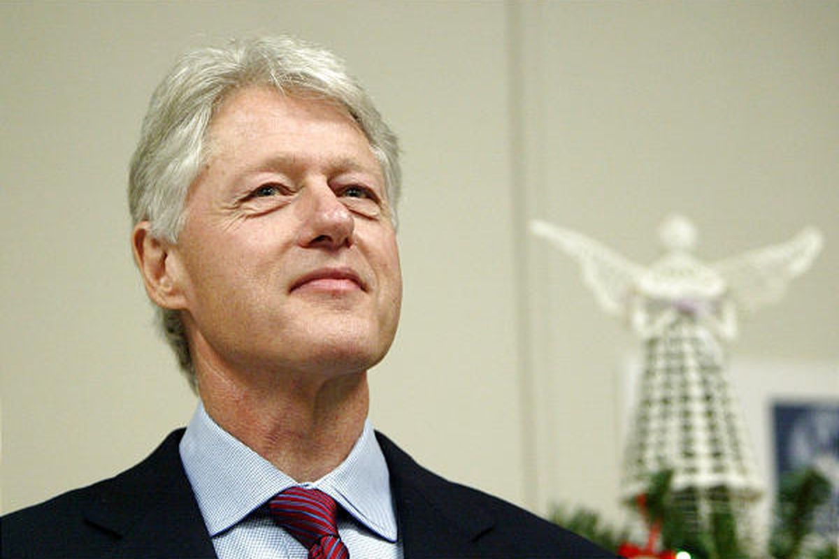 Former President Bill Clinton waits his turn at the podium before formally thanking the staff at Westchester Medical Center, in Valhalla, N.Y. for diagnosing the heart condition that led to his quadruple bypass surgery in August 2004. Clinton was hospital