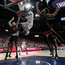 Arizona guard Dylan Smith (3) tries an up-and-under layup during the Arizona-Oregon State game in McKale Center on January 19 in Tucson, Ariz.