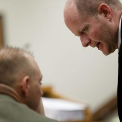 Chad Grunander, Utah County prosecutor, right, speaks to Sam Pead, fellow Utah County prosecutor, during the trial of Martin MacNeill at 4th District Court in Provo Wednesday, Oct. 30, 2013. MacNeill is charged with murder for allegedly killing his wife, Michele MacNeill, in 2007.