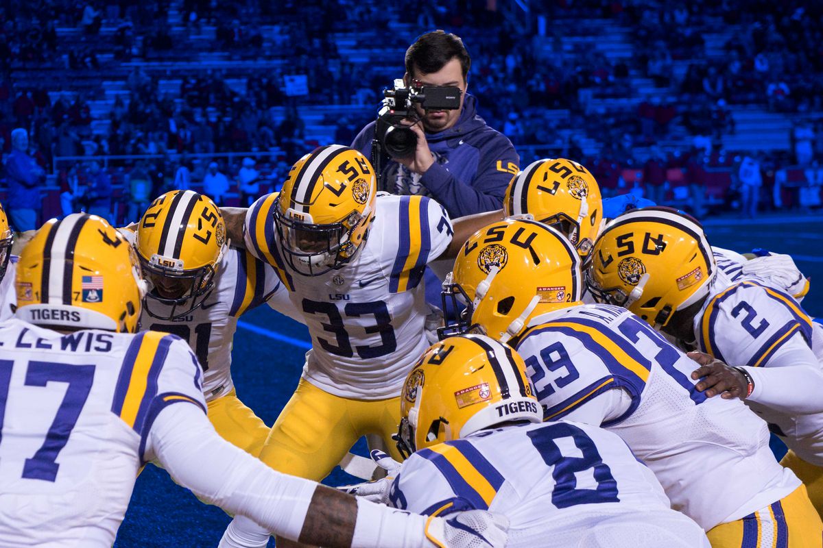 LSU players huddle before a game.
