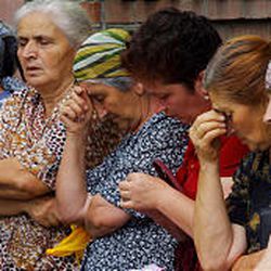 Ossetian women wait for news near the school seized by attackers in Beslan, North Ossetia. Many of the hostages were children, most of them under 14 years old.