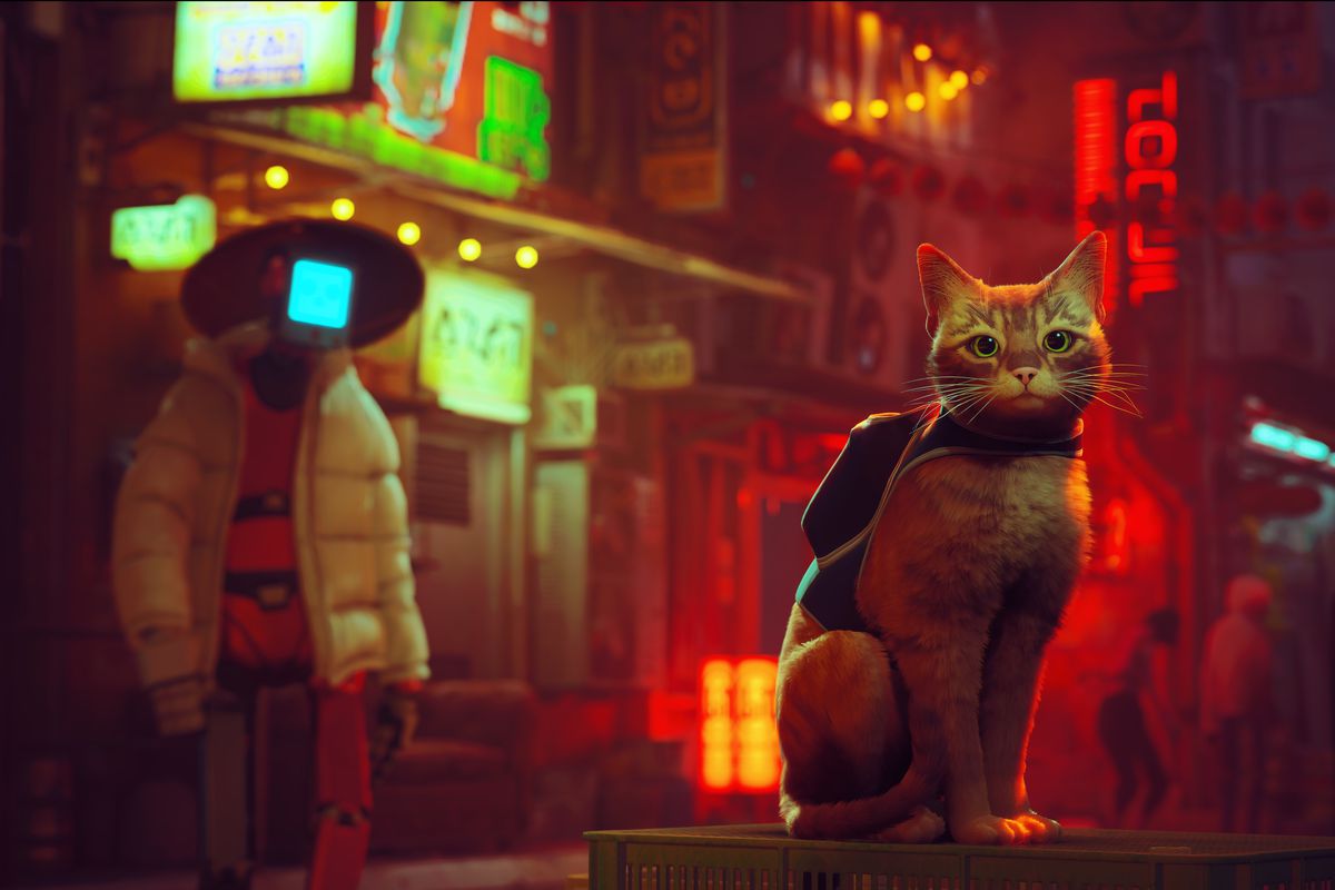 The unnamed orange cat of Stray sits, wearing a backpack, with a humanoid robot and a neon-lit city behind it