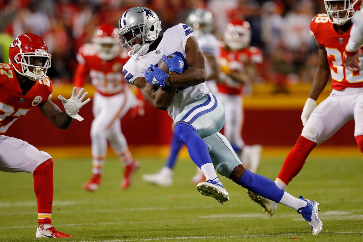 Michael Gallup #13 of the Dallas Cowboys makes a catch in front of Rashad Fenton #27 of the Kansas City Chiefs during the third quarter of the game at Arrowhead Stadium on November 21, 2021 in Kansas City, Missouri.