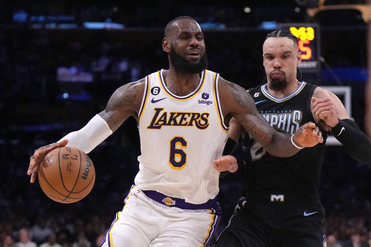 Los Angeles Lakers forward LeBron James (6) dribbles the ball against Memphis Grizzlies forward Dillon Brooks (24) in the second quarter during game three of the 2023 NBA playoffs at Crypto.com Arena.
