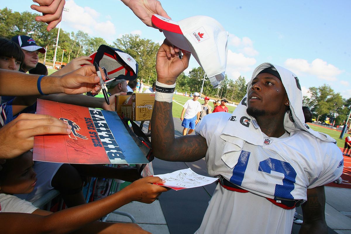 PITTSFORD, NY - AUGUST 08:  Stevie Johnson #13  of the Buffalo Bills signs autographs during the Buffalo Bills Training Camp at St. John Fisher College on August 8, 2011 in Pittsford, New York.  (Photo by Rick Stewart/Getty Images)
