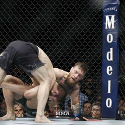 Khabib Nurmagomedov takes Conor McGregor down