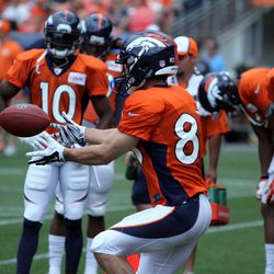 Wes Welker works on foot work and hand work during WR drills