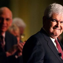 Former Speaker Newt Gingrich, right, accepts the crowd's applause before speaking at Senator Bob Bennett's campaign kickoff announcement  at the Grand America Hotel in Salt Lake City on February 3, 2010.