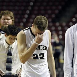 Desert Hills forward Quincy Mathews (22) shows his disappointment after losing to Dixie in the 3A boys basketball semifinals at the Maverik Center in West Valley City Friday, Feb. 27, 2015.