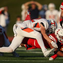 East's Jaylen Warren runs for a first down as East football moves toward a win over Timpview in Salt Lake City on Friday, Nov. 4, 2016.