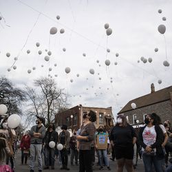 Dozens of people release balloons during a vigil for 13-year-old Adam Toledo near the location of the shooting at West 24th Street and South Sawyer Avenue in Little Village, Monday afternoon, April 5, 2021. Toledo was fatally shot in the chest by a Chicago police officer in an alley west of the 2300 block of South Sawyer Avenue near Farragut Career Academy High School.