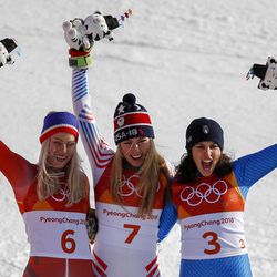 Silver medalist Ragnhild Mowinckel, of Norway, right, gold medalist Mikaela Shiffrin, of the United States, center, and bronze medalist Federica Brignone, of Italy, right, celebrate during the venue ceremony at the Women's Giant Slalom at the 2018 Winter Olympics in Pyeongchang, South Korea, Thursday, Feb. 15, 2018., Thursday, Feb. 15, 2018. (AP Photo/Jae C. Hong)