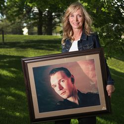 James Mason Centers for Recovery founder Trisa McBride holds a photo of her son James in Taylorsville on Wednesday, May 16, 2018. McBride lost her son after his anxiety and depression spiraled into drug use, which eventually led to a fatal overdose.
