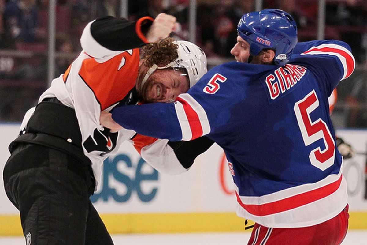 NEW YORK - APRIL 09:  Dan Girardi #5 of the New York Rangers fights with Scott Hartnell #19 of the Philadelphia Flyers during their game on April 9, 2010 at Madison Square Garden in New York City.  (Photo by Chris McGrath/Getty Images)
