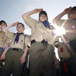 Boy Scouts salute early Saturday morning, May 21, 2011 during New Jersey's Boy Scouts Camporee in Sea Girt, N.J. The Boy Scouts of America's National Council has voted to ease a long-standing ban and allow openly gay boys to be accepted as Scouts, Thursday, May 23, 2013. Of the local Scout leaders voting at their annual meeting in Texas, more than 60 percent supported the proposal. 