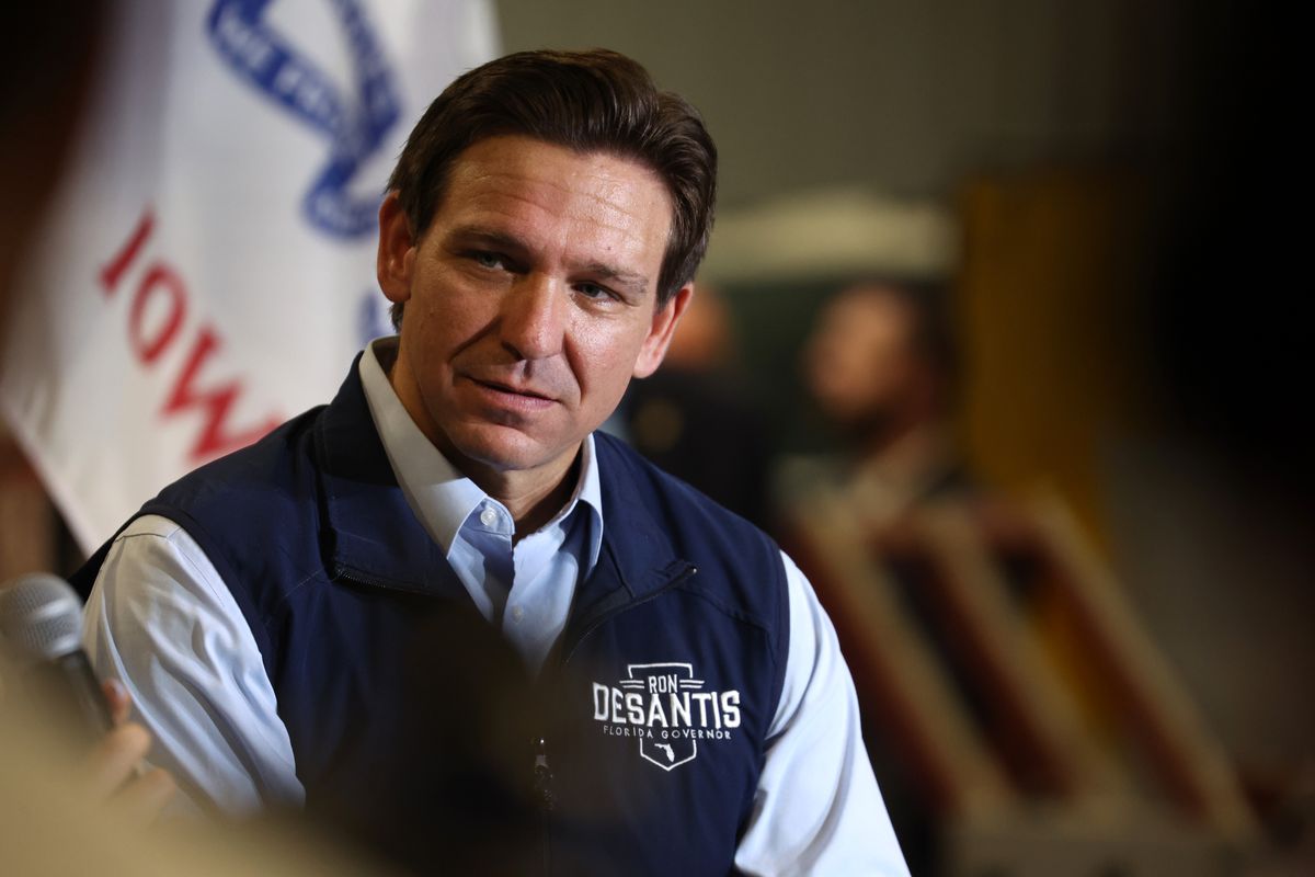 Republican presidential candidate Florida Governor Ron DeSantis listens as his wife Casey speaks during a campaign rally at Port Neal Welding Company on May 31, 2023 in Salix, Iowa.