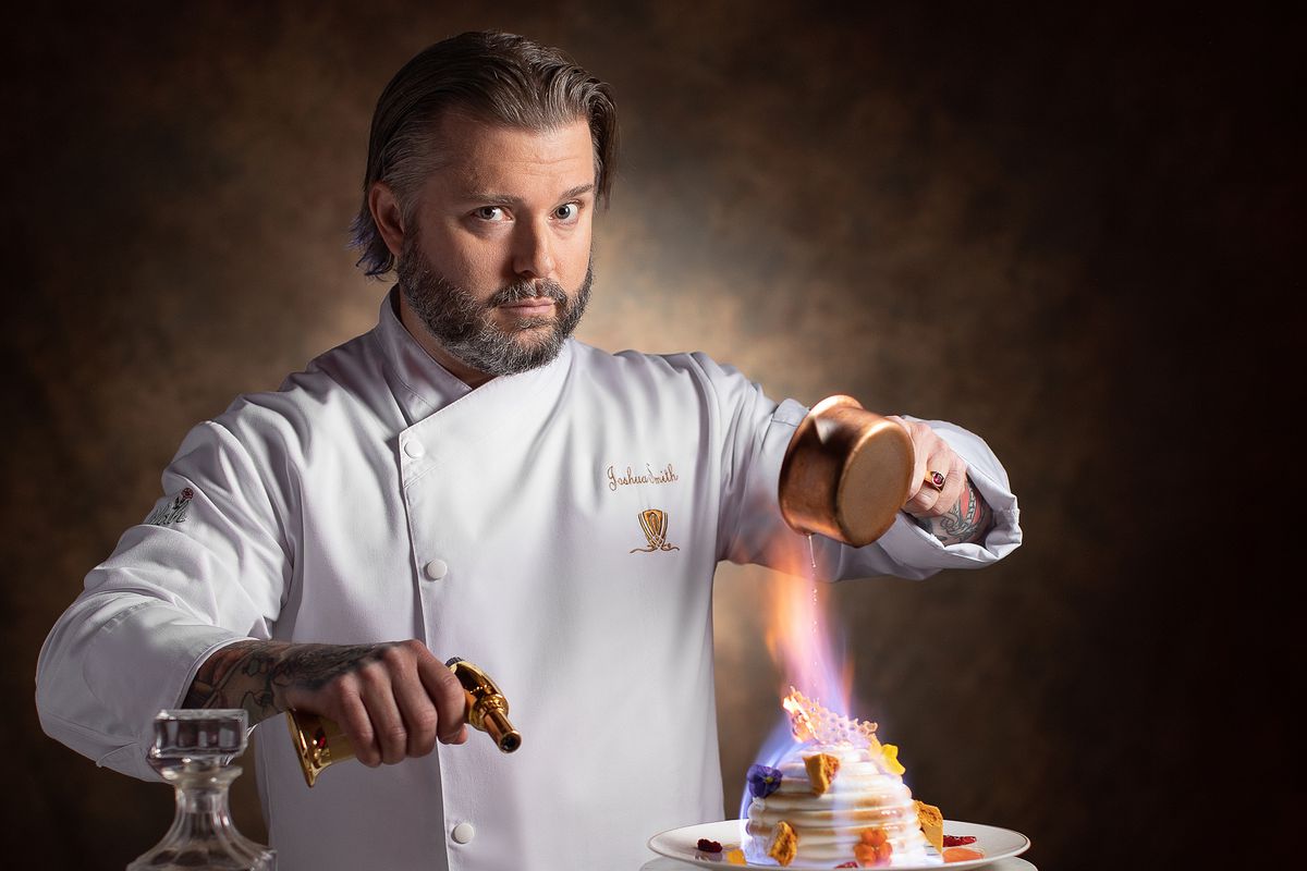 Chef Joshua Smith torches a meringue dessert