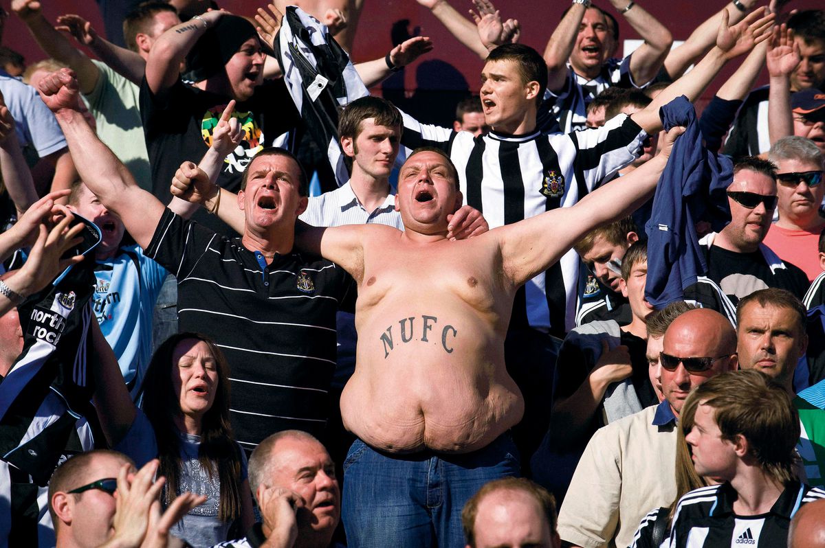 Newcastle fans singing in the stands.
