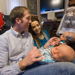Layne and Bobbisue Christensen with their 6-week-old twins, Ruthann and Martin, at their home in Brigham City on Tuesday, Dec. 29, 2015.