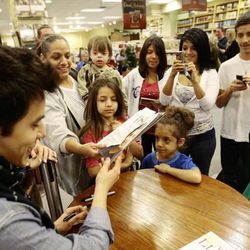 David Archuleta signs autographs at a signing event at the Deseret Book at Ft. Union in Midvale on Nov. 22.
