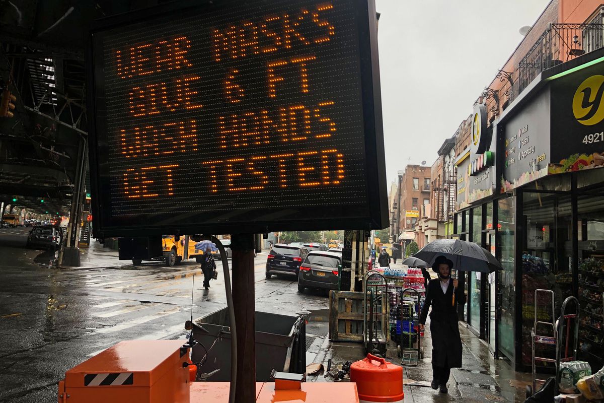 The city placed a sign in Borough Park, Brooklyn imploring residents to follow safety guidelines during the coronavirus outbreak, Oct. 13, 2020.