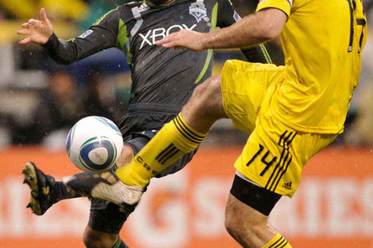 COLUMBUS, OH - MAY 7:  Chad Marshall #14 of the Columbus Crew gets control of a loose ball in front of Roger Levesque #24 of the Seattle Sounders on May 7, 2011 at Crew Stadium in Columbus, Ohio.  (Photo by Jamie Sabau/Getty Images)