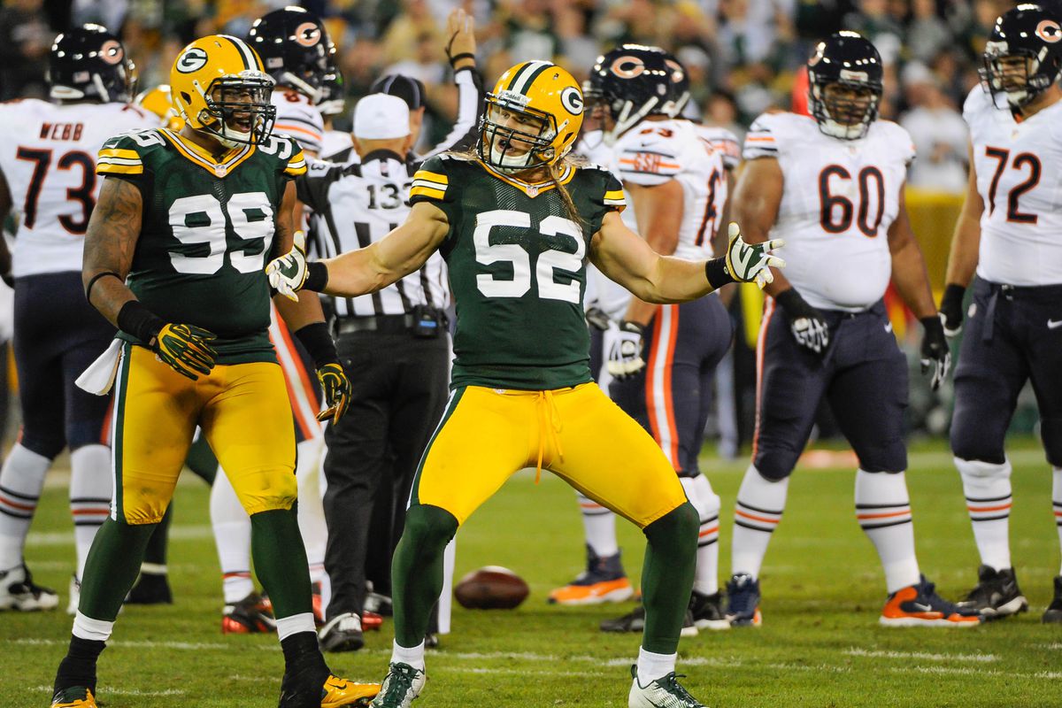 Sept 13, 2012; Green Bay, WI, USA;  Green Bay Packers linebacker Clay Matthews (52) celebrates with defensive tackle Jerel Worthy (99) after a sack during the game against the Chicago Bears at Lambeau Field.  Mandatory Credit: Benny Sieu-US PRESSWIRE