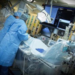 University Hospital cardiologists perform a procedure to deploy the CardioKinetix Parachute device within the heart of Larry Davis, of Nebraska, who suffered a nearly fatal heart attack, on Wednesday, Feb. 11, 2015.