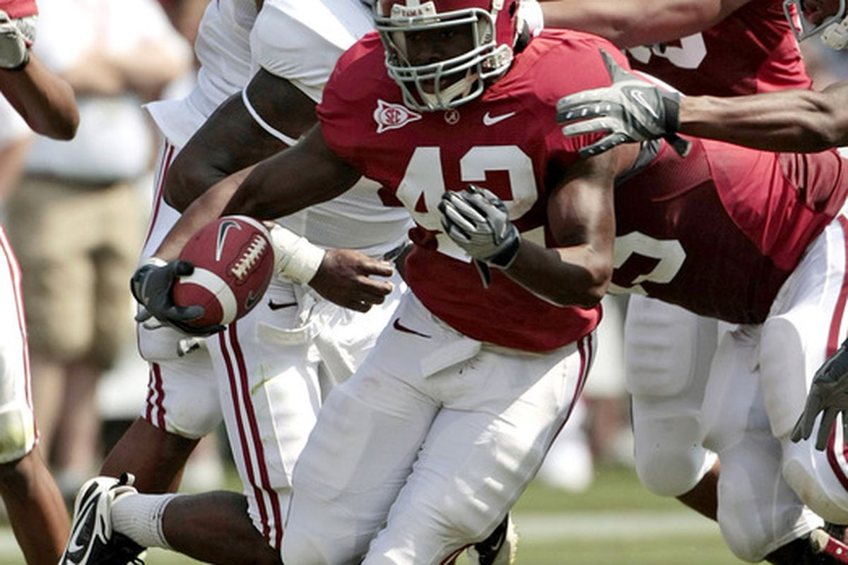 Running back Eddie Lacy (#42) runs for yardage during the A Day Game at Bryant Denny Stadium.