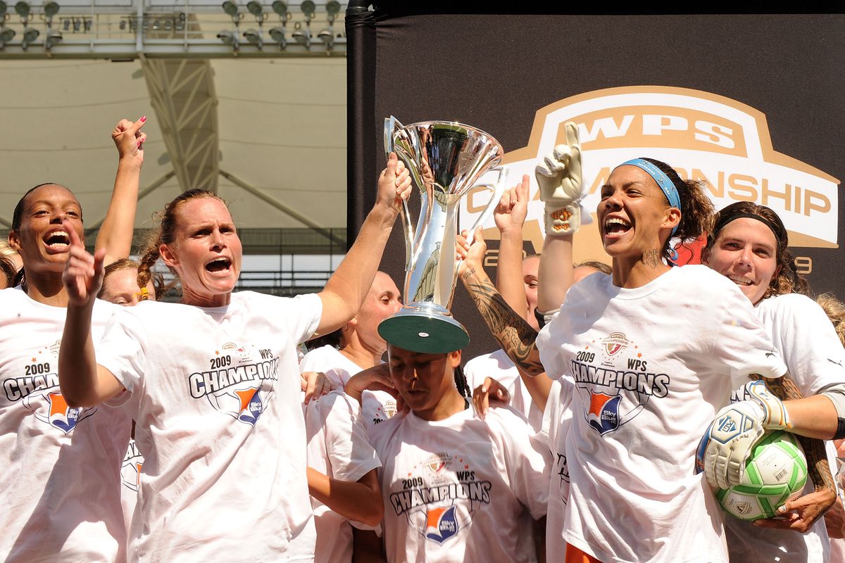 Head coach and captain Christie Rampone and forward Natasha Kai after the 2009 WPS championship. 
